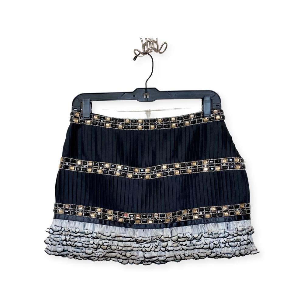 BEBE feather, sequins, and lace decorated mini skirt